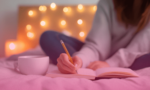 Woman journaling and sipping coffee in bed, finding peace and comfort through Scripture — '5 Powerful Bible Verses for Anxiety